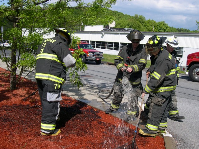 How Many Guys Does It Take To Put Out A Smoldering Mulch Pile??